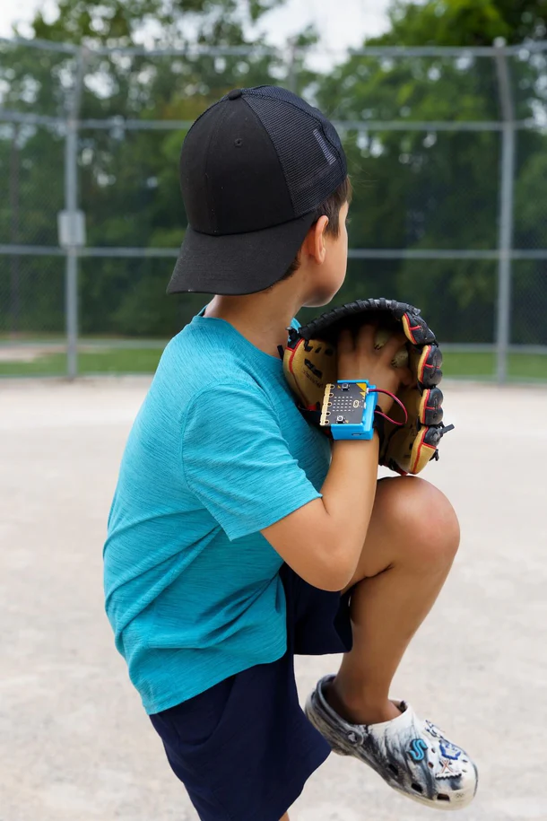 Summer camp kids building robots outdoors